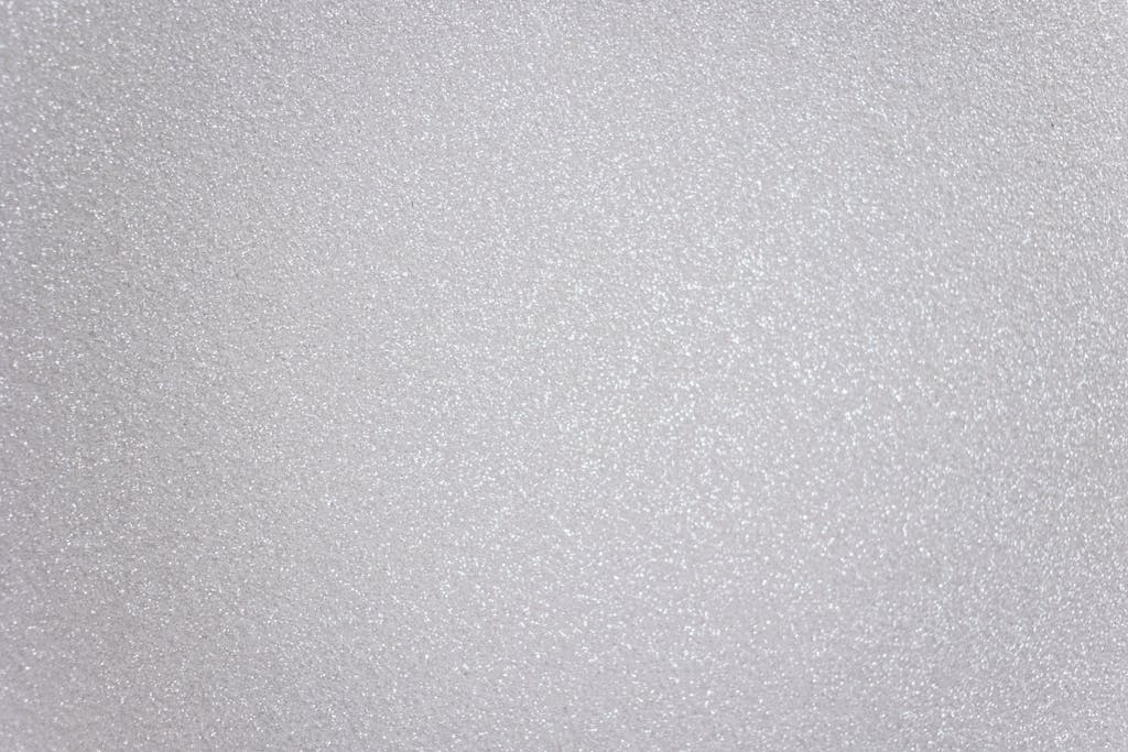 Abstract textured background representing light gray surface with many tiny drops of water